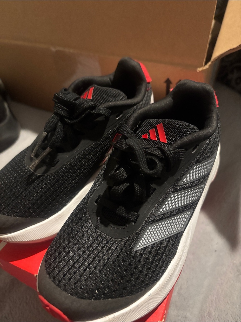 adidas Black Running Shoes with Red and Silver Accents